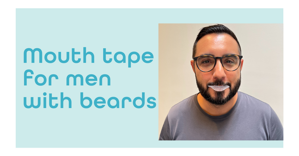 man with beard and glasses wearing mouth tape from dryft sleep facial hair with mouth tape on a male
